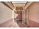 Inviting front entryway with decorative security gate, leading to a cozy, covered porch at 7033 Red Tide Dr, Las Vegas, NV 89131
