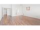 Spacious open-concept living area with laminate wood floors and access to other rooms at 7033 Red Tide Dr, Las Vegas, NV 89131