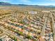 Aerial view of a neighborhood with mountain views and desert landscaping at 7033 Red Tide Dr, Las Vegas, NV 89131