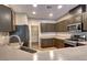 Modern kitchen featuring stainless steel appliances and ample cabinet space at 7322 Fools Gold St # 102, Las Vegas, NV 89149