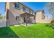 Backyard featuring artificial grass, a covered patio, and a built-in basketball hoop at 7900 Eastern Elk St, Las Vegas, NV 89149