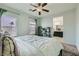 Light-filled bedroom with ceiling fan, two windows and en suite bathroom at 7900 Eastern Elk St, Las Vegas, NV 89149
