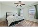Well-lit bedroom with a ceiling fan, neutral walls, and cozy carpet flooring at 7900 Eastern Elk St, Las Vegas, NV 89149