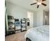 Comfortable bedroom featuring two bookshelves and a view of the attached bathroom at 7900 Eastern Elk St, Las Vegas, NV 89149