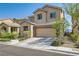 Charming two-story home featuring desert landscaping, covered entry, and attached two-car garage at 7900 Eastern Elk St, Las Vegas, NV 89149