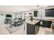 Stylish kitchen and dining area featuring granite countertops, stainless appliances and open living space at 7900 Eastern Elk St, Las Vegas, NV 89149