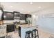 Modern kitchen with granite countertops, stainless steel appliances, and center island at 7900 Eastern Elk St, Las Vegas, NV 89149