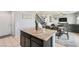 Open-concept kitchen boasts granite countertops, a center island, and stainless steel appliances at 7900 Eastern Elk St, Las Vegas, NV 89149