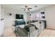 Comfortable living room with tile floors, ceiling fan, and entertainment center at 7900 Eastern Elk St, Las Vegas, NV 89149