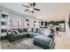 Open-concept living area with tile floors, sofa, and view of the kitchen at 7900 Eastern Elk St, Las Vegas, NV 89149