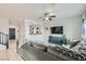 Comfortable living room with tile floors, ceiling fan, and a large sofa at 7900 Eastern Elk St, Las Vegas, NV 89149