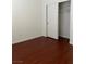 Bedroom with wood floors and a closet at 7977 Blue Brook Dr, Las Vegas, NV 89147