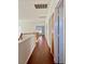 Upstairs hallway with wood floors and wooden railing at 7977 Blue Brook Dr, Las Vegas, NV 89147