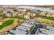 Beautiful aerial view of a lakeside community featuring lush landscaping and picturesque homes at 8 Reflection Cove Dr, Henderson, NV 89011