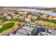 Beautiful aerial view of a lakeside community featuring lush landscaping and picturesque homes at 8 Reflection Cove Dr, Henderson, NV 89011