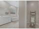 Bright bathroom features soaking tub, double vanity, and separate toilet room at 8 Reflection Cove Dr, Henderson, NV 89011