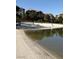 Beautiful beach view with crystal clear water and beachside seating in this lake community at 8 Reflection Cove Dr, Henderson, NV 89011