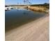Picturesque view of the beach front and water access with dock at this community at 8 Reflection Cove Dr, Henderson, NV 89011