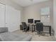 Office space featuring a sleeper sofa and dual workstation setup at 8 Reflection Cove Dr, Henderson, NV 89011