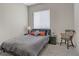Cozy bedroom with plush carpet, neutral walls, and comfortable furnishings at 8 Reflection Cove Dr, Henderson, NV 89011