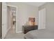 Neutral bedroom featuring a soft grey bedspread, modern furniture, and ample natural light at 8 Reflection Cove Dr, Henderson, NV 89011