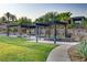 Serene community space featuring shaded seating areas and landscaped surroundings at 8 Reflection Cove Dr, Henderson, NV 89011
