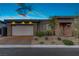 Charming single-story home boasting a two-car garage, stone accents, and a well-manicured front yard at 8 Reflection Cove Dr, Henderson, NV 89011