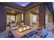 Inviting outdoor patio with comfortable seating and a modern fire pit, creating a warm and stylish space at 8 Reflection Cove Dr, Henderson, NV 89011