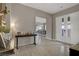 Bright foyer with elegant tile flooring, a decorative console table, and a glimpse of the dining area at 8 Reflection Cove Dr, Henderson, NV 89011