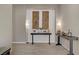 Elegant foyer features stylish console tables, decorative accents, and tile flooring, creating a welcoming ambiance at 8 Reflection Cove Dr, Henderson, NV 89011