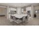 Spacious kitchen features a large center island with seating, modern stainless steel appliances, and bright lighting at 8 Reflection Cove Dr, Henderson, NV 89011