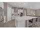 Spacious kitchen featuring a large center island with seating and modern stainless steel appliances at 8 Reflection Cove Dr, Henderson, NV 89011