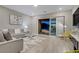 Contemporary living room featuring stylish decor and a sliding glass door to the patio at 8 Reflection Cove Dr, Henderson, NV 89011