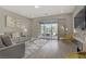 Inviting living room provides seamless indoor-outdoor flow through sliding glass doors to the outdoor patio at 8 Reflection Cove Dr, Henderson, NV 89011
