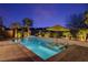 Stunning backyard pool and spa area with lush tropical landscaping and a relaxing ambiance at 8 Reflection Cove Dr, Henderson, NV 89011