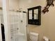 Shower with tiled enclosure, glass door, and updated fixtures in a bright bathroom at 8088 Smoking Jacket Pl, Las Vegas, NV 89166
