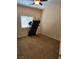 Bedroom with neutral carpet, a treadmill, ceiling fan, and window with blinds at 8088 Smoking Jacket Pl, Las Vegas, NV 89166