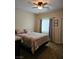 Serene bedroom featuring soft lighting, a plush bed, and a comfortable atmosphere at 8088 Smoking Jacket Pl, Las Vegas, NV 89166