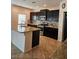 Modern kitchen with granite countertops, stainless steel appliances and a tiled backsplash at 8088 Smoking Jacket Pl, Las Vegas, NV 89166