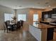 Spacious kitchen with dining area, granite countertops, stainless steel appliances and tiled floors at 8088 Smoking Jacket Pl, Las Vegas, NV 89166