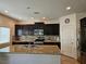 Modern kitchen with stainless steel appliances, granite countertops and a tiled backsplash at 8088 Smoking Jacket Pl, Las Vegas, NV 89166