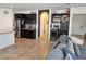 Open living space with kitchen view, and access to backyard patio at 8088 Smoking Jacket Pl, Las Vegas, NV 89166