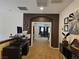 Upstairs loft space with dark trim, desk, and views into other rooms at 8088 Smoking Jacket Pl, Las Vegas, NV 89166