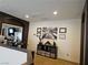 Upstairs loft featuring dark accent walls, built-in storage, and a desk at 8088 Smoking Jacket Pl, Las Vegas, NV 89166