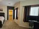Main bedroom features dark window coverings and an entry to a walk-in closet at 8088 Smoking Jacket Pl, Las Vegas, NV 89166