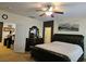 Relaxing main bedroom featuring neutral walls, cozy carpet, and a stylish ceiling fan for added comfort at 8088 Smoking Jacket Pl, Las Vegas, NV 89166