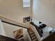 View of a staircase leading to the living area with a painting on the wall at 8088 Smoking Jacket Pl, Las Vegas, NV 89166