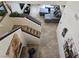 Staircase to the living room featuring tile floors and a large sectional sofa at 8088 Smoking Jacket Pl, Las Vegas, NV 89166