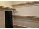 Neutral walk-in closet with shelves and hanging bars at 8088 Smoking Jacket Pl, Las Vegas, NV 89166