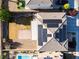 Birds-eye view of the home showcasing the roof with solar panels, patio, and landscaping at 8112 Sapphire Sea St, North Las Vegas, NV 89085